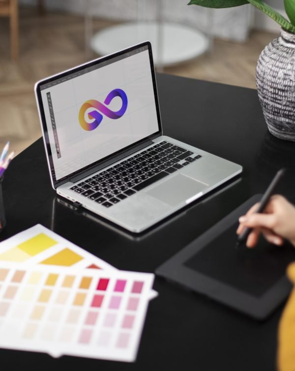 female-logo-designer-working-her-tablet-connected-laptop
