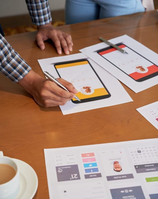 Close-up image of designer working on social media interface