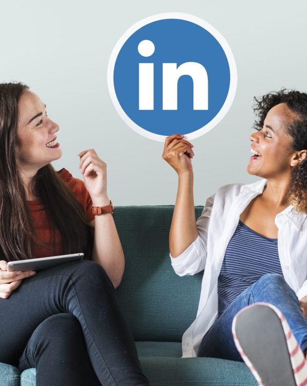 Women holding a Linkedin logo